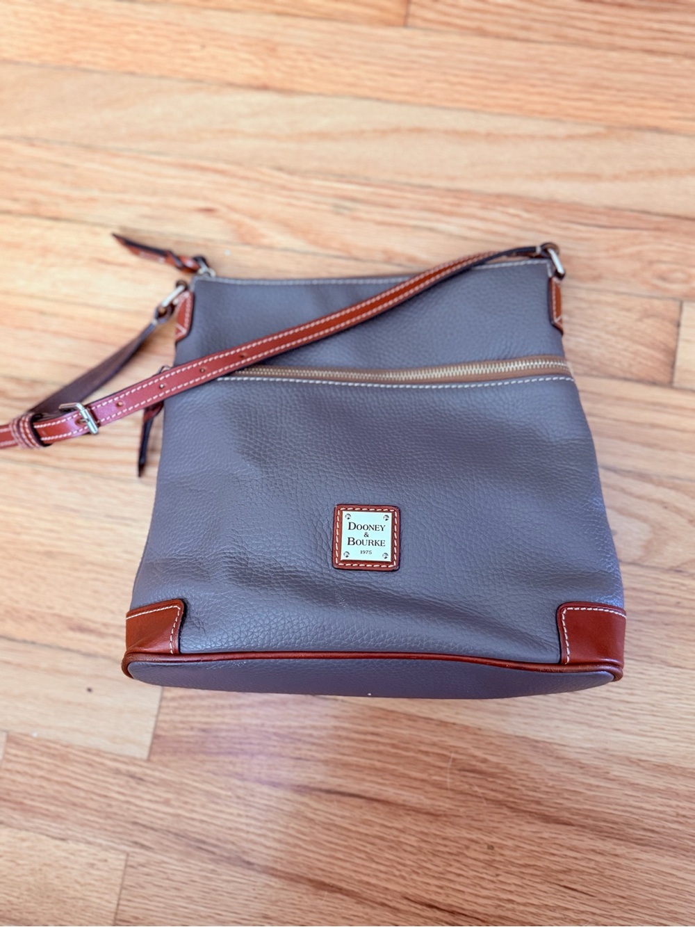 Dooney & Bourke Elephant Leather shoulder bag with Brown Trim.